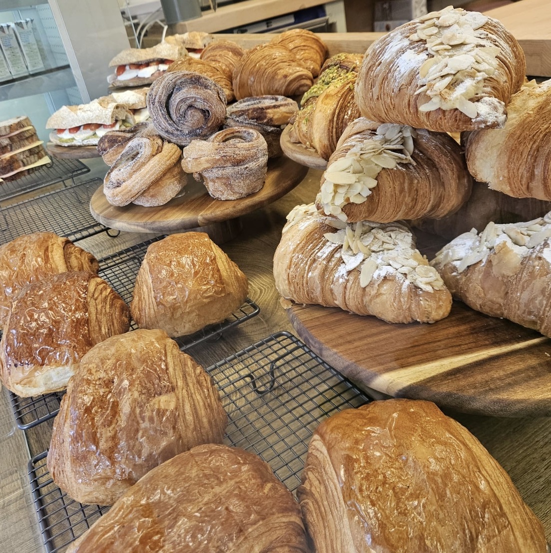 Fresh croissants and pastries displayed at the Front Room Coffee counter
